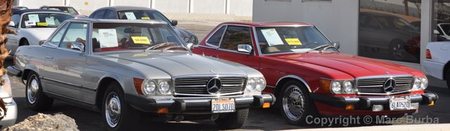 Two older SL-Class Mercedes on consignment at an Indian Canyon Drive business.